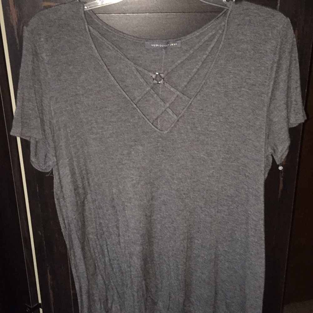 grey t shirt with diagonal design on the chest